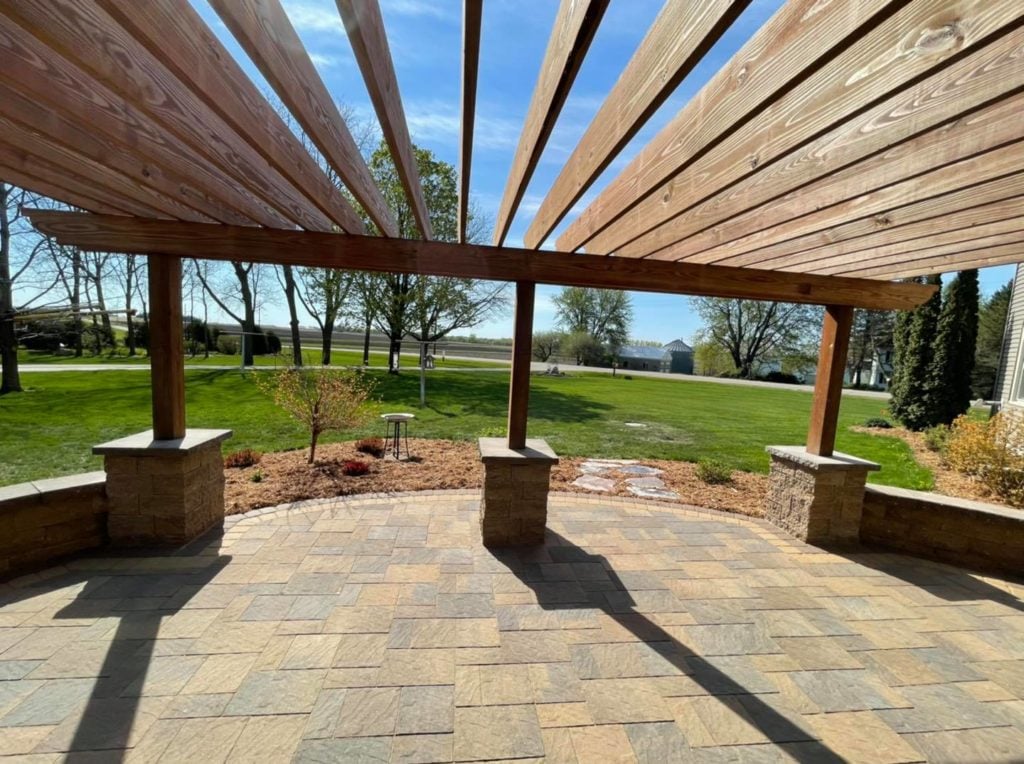 patio with seating wall and pergola